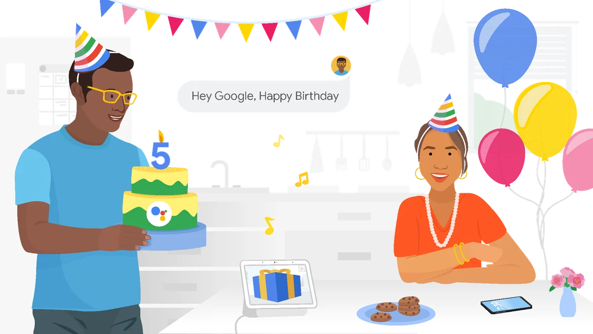 A man holds a cake with a number 5 candle and the Google Assistant logo, while a woman sits at a table. Both wear party hats, and a text bubble in the background reads “Hey Google, Happy Birthday”