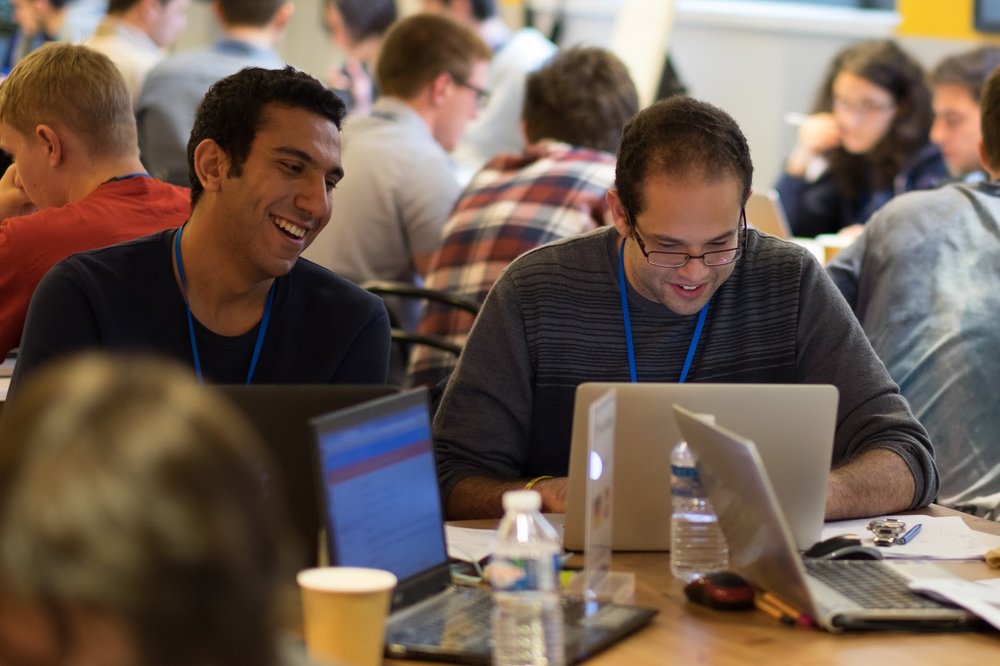 Teams work together to schedule satellite operations during the 2016 Hash Code Final Round at Google Paris.