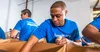 A Google.org volunteer loads food into a box.