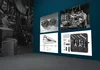 A screenshot of the interior of a virtual gallery featuring black and white photography of mechanical motorcycle parts from the Harley Davidson Museum