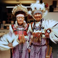 A color photograph of two women standing side by side.