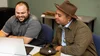 Jake Foreman, a Grow with Google Indigenous Community Digital Coach, is seated in front of a laptop smiling as he trains someone during a 1:1 session.