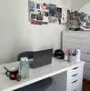 Yasmin's work from home set up with a desk and laptop.