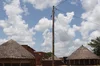 Thatched huts connected to a power line