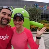 Jesus and his wife pose outside with an android statue at Google headquarters.