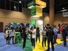Googlers and students interacting at a career fair booth.