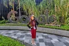 Snehal standing outdoors standing in front of large Google sign and foliage.