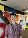 Matt posing in front of Google logo