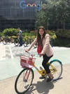 Dina on a Google bike outdoors.