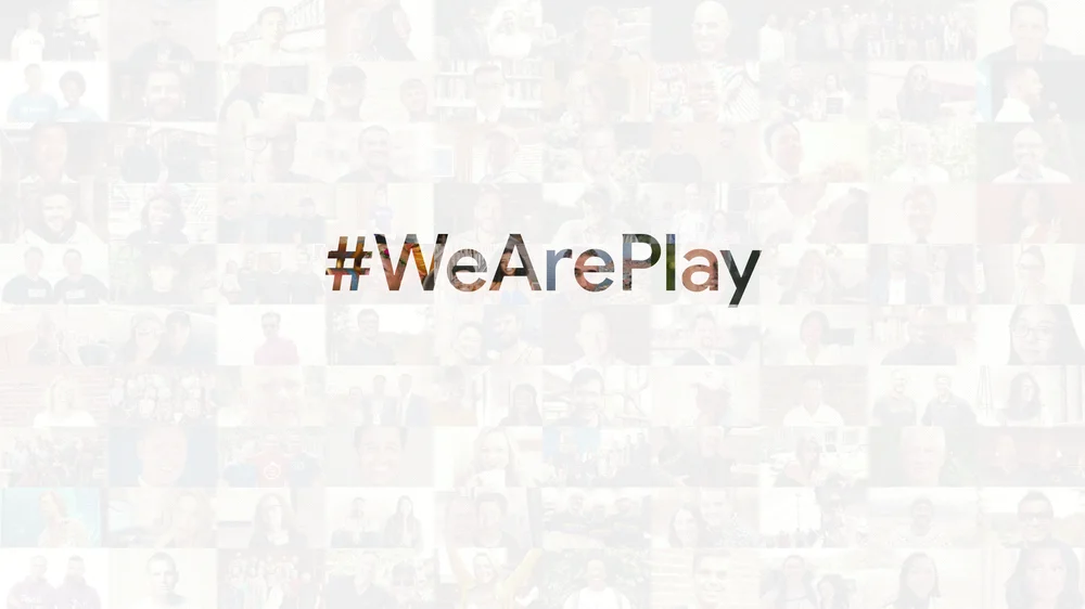 The text “#WeArePlay” on top of faded pictures featuring the faces of U.S. developers.
