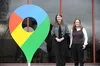 Two women - Secretary of State for Science, Innovation and Technology Michelle Donelan and Google UK MD Debbie Weinstein-  are standing outside of the Chippenham Business Cyber Center next to a colourful oversized Google Maps logo