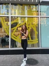 SoulCycle instructor Jane, based in Austin, poses outside of a SoulCycle studio.