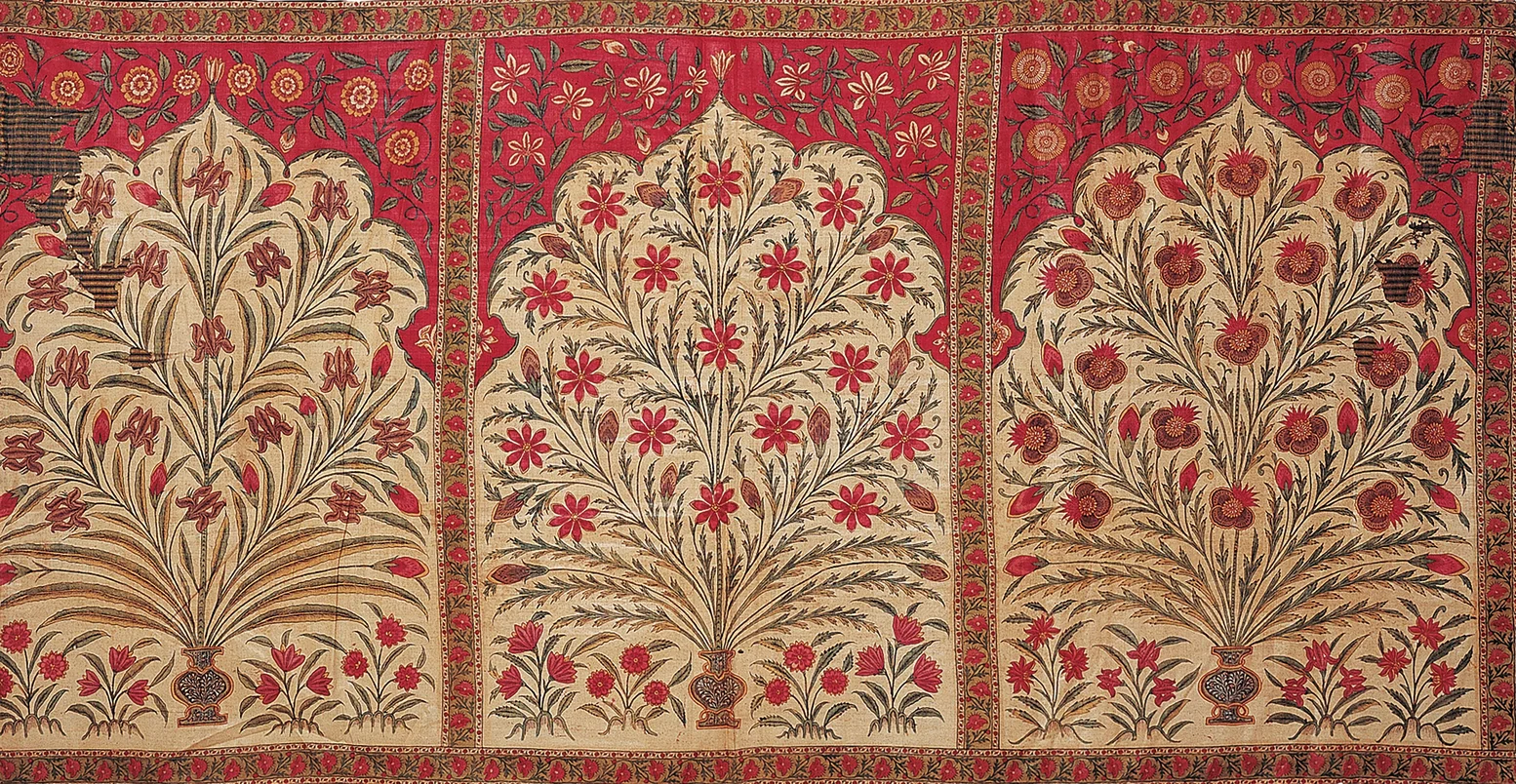 Intricate woven cloth split into three visual sections, each one with a border of red and yellow pattern, depicting an abstract vase of flowers against a red background.