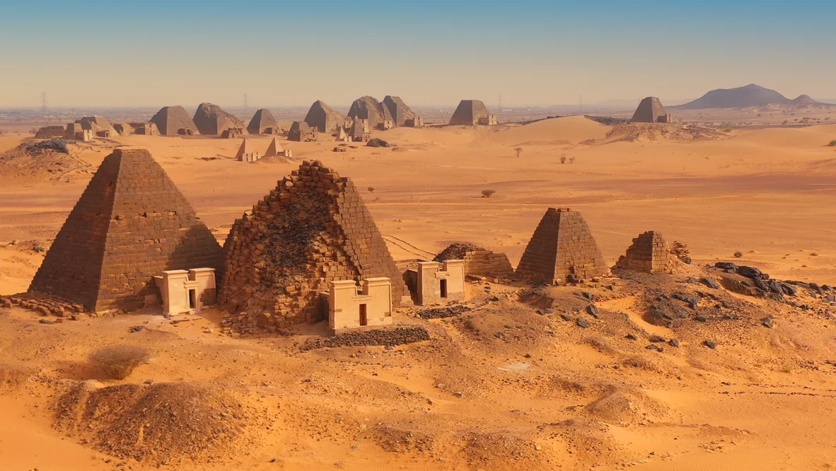 A series of steep pyramids extends across the horizon.