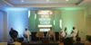 5 men sitting on a stage at an event, in front of a screen which has "The Lagos gubernatorial debates 2023" in the background