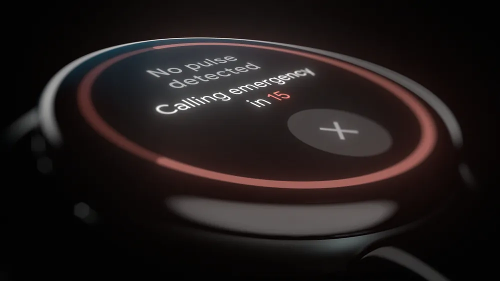 The face of a Pixel Watch 3 against a black background. On the watch there’s text that says No pulse detected, Calling emergency in 15. Underneath the text is an X in a circle, which a user can tap to stop the countdown.