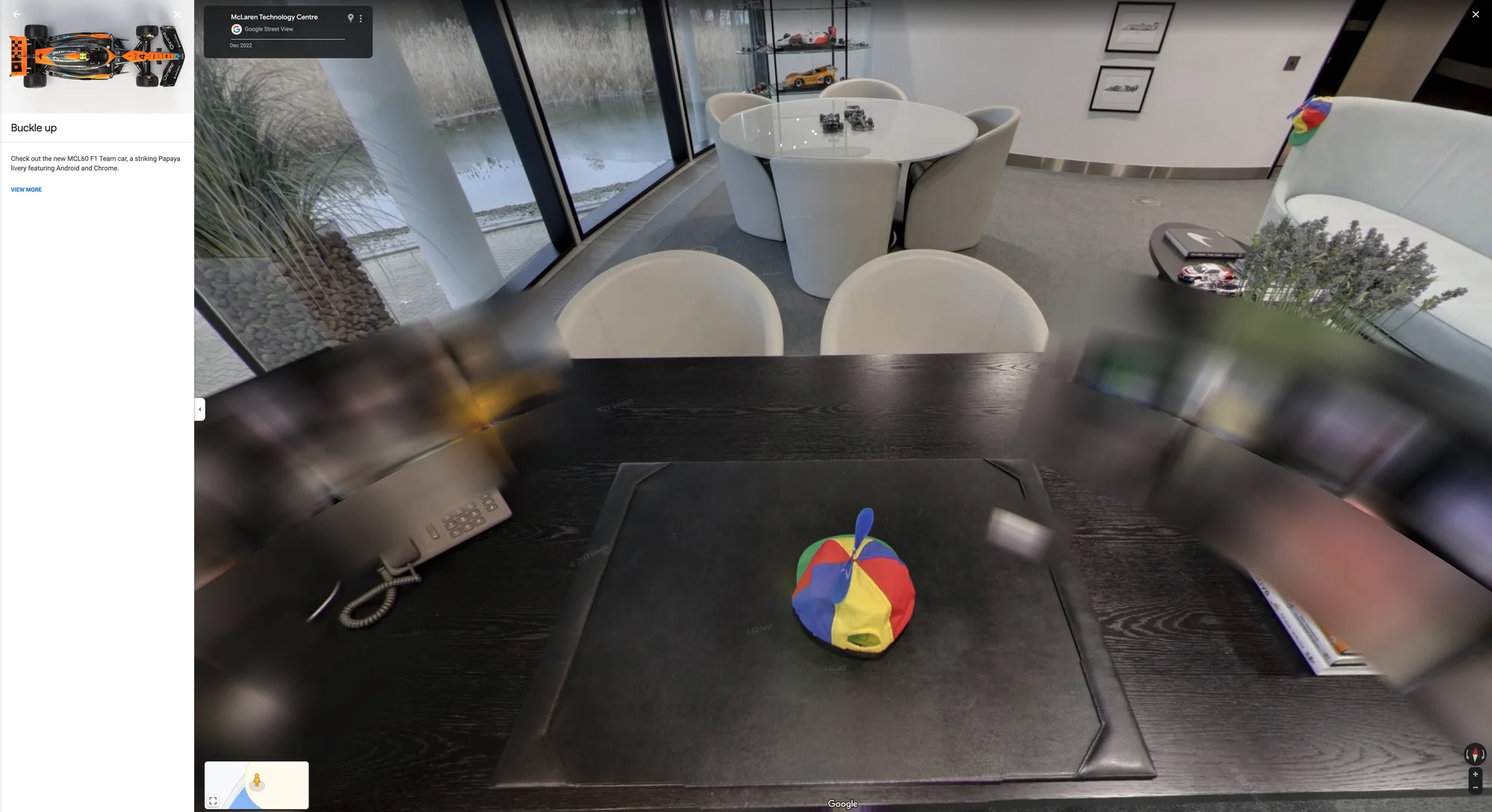 Street View imagery shows the inside of McLaren CEO Zak Brown's office featuring a Noogler hat on a desk.