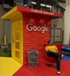 Jesus sitting in a chair at a Google career fair booth.