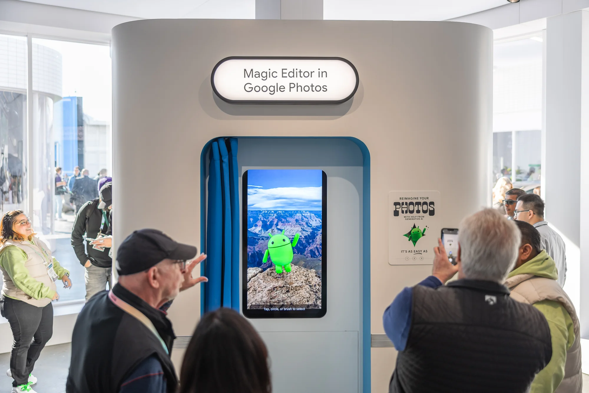 The second shows a group of people gathered around a photobooth where a demo of Magic Editor in Google Photos plays on a screen in the background.