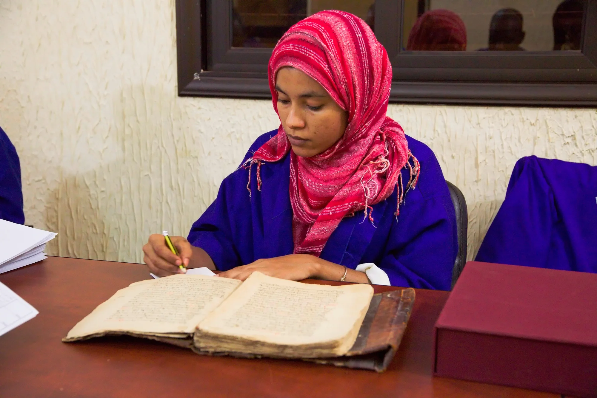 Cataloging the manuscripts.