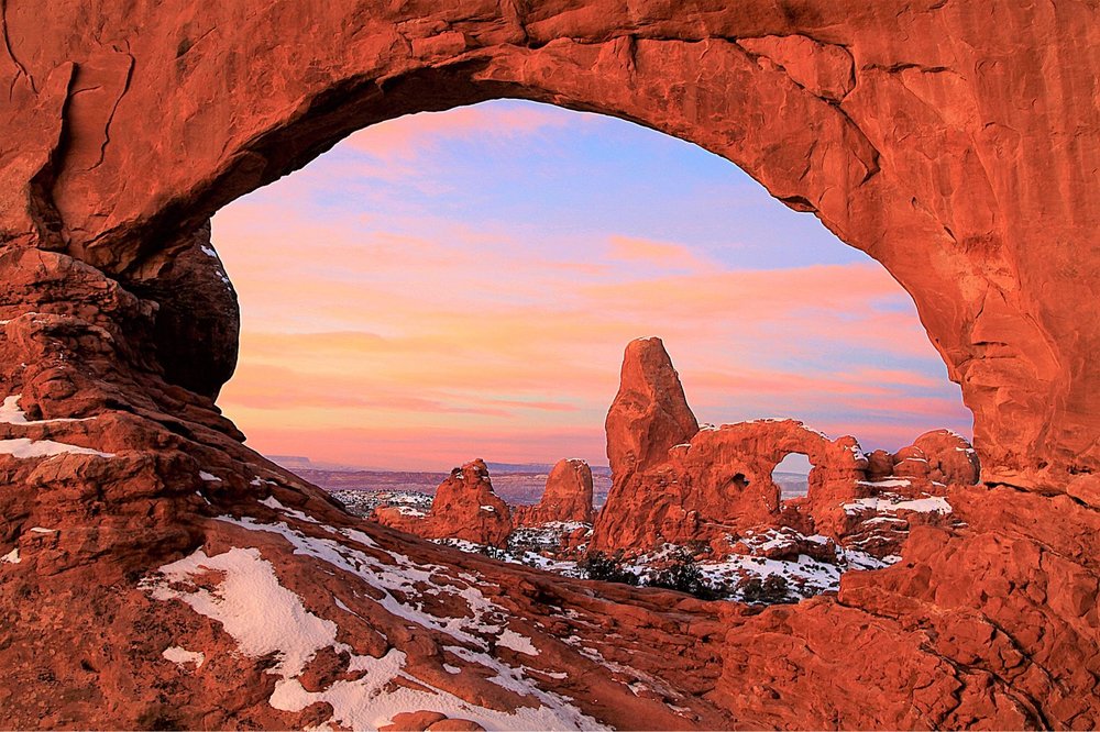 A photo of the castle-like rock formations at Turret Arch in Moab, Utah.