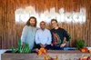 YouTube CEO, Neal Mohan with Rhett and Link in front of a sign that says Mythical