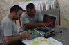 Two HALO staff in Nagorno Karabakh studying the minefields with Google Earth