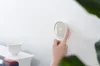 Person using Nest Thermostat