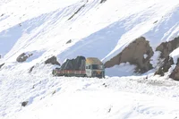 Pic of truck traveling through snow landscape