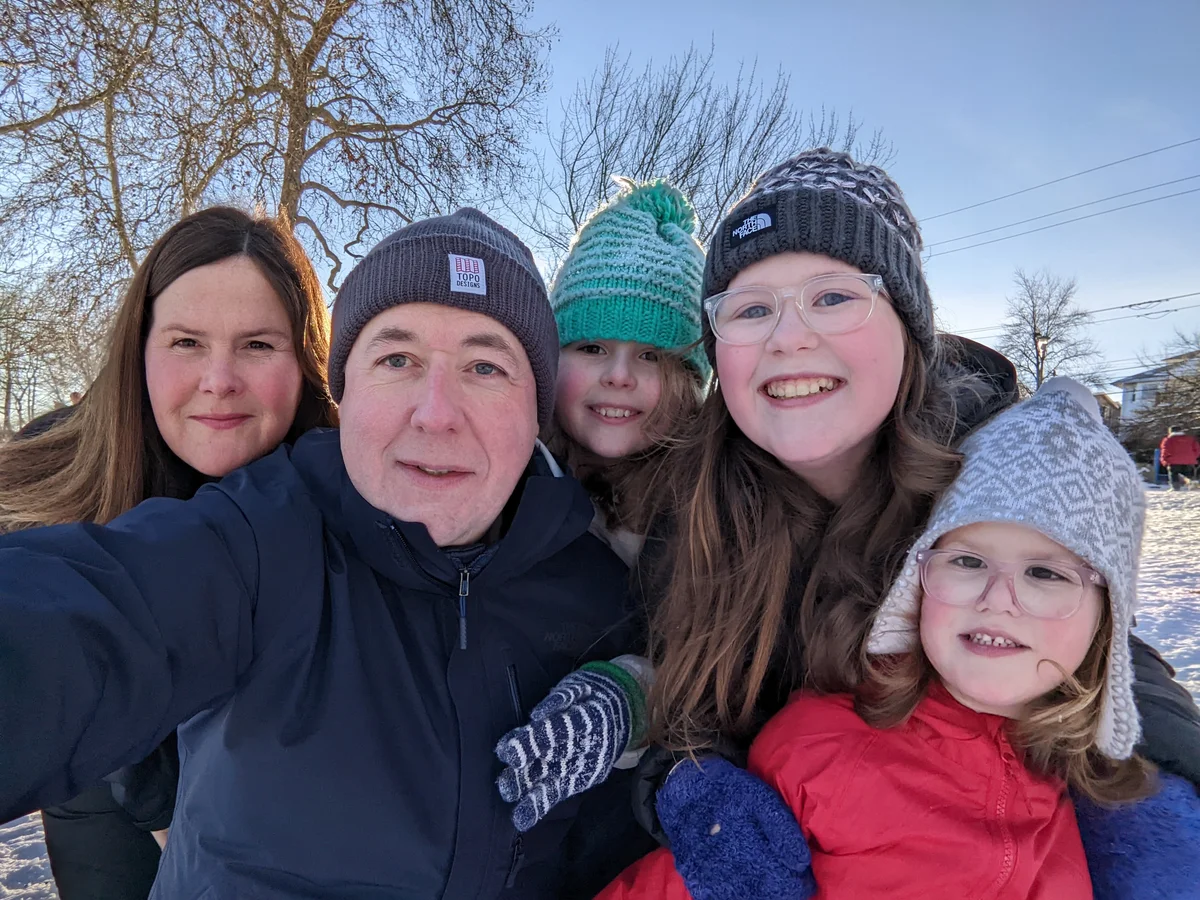 Matthew with his wife and three daughters.