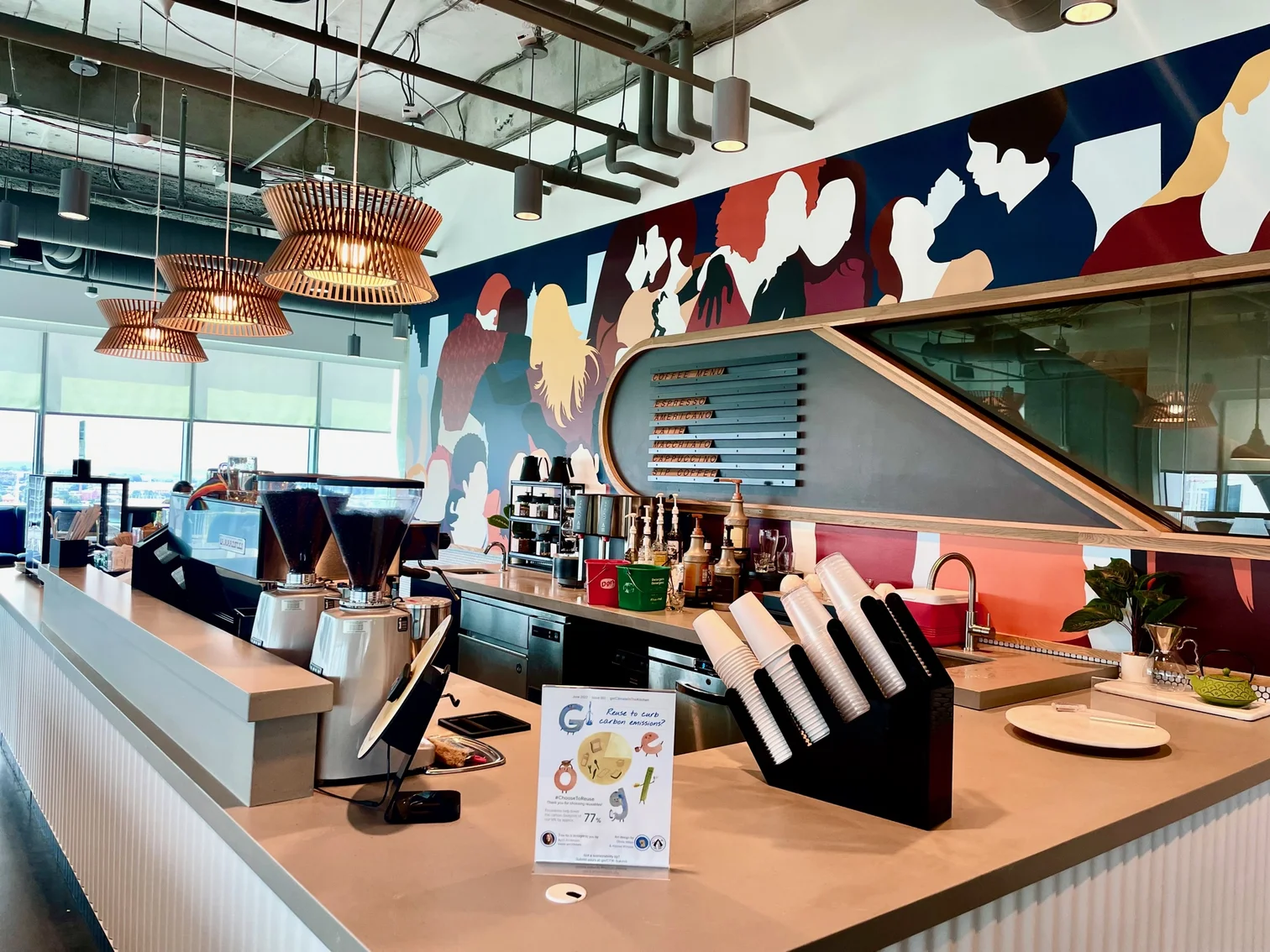 A coffee bar with espresso machines located inside a cafeteria