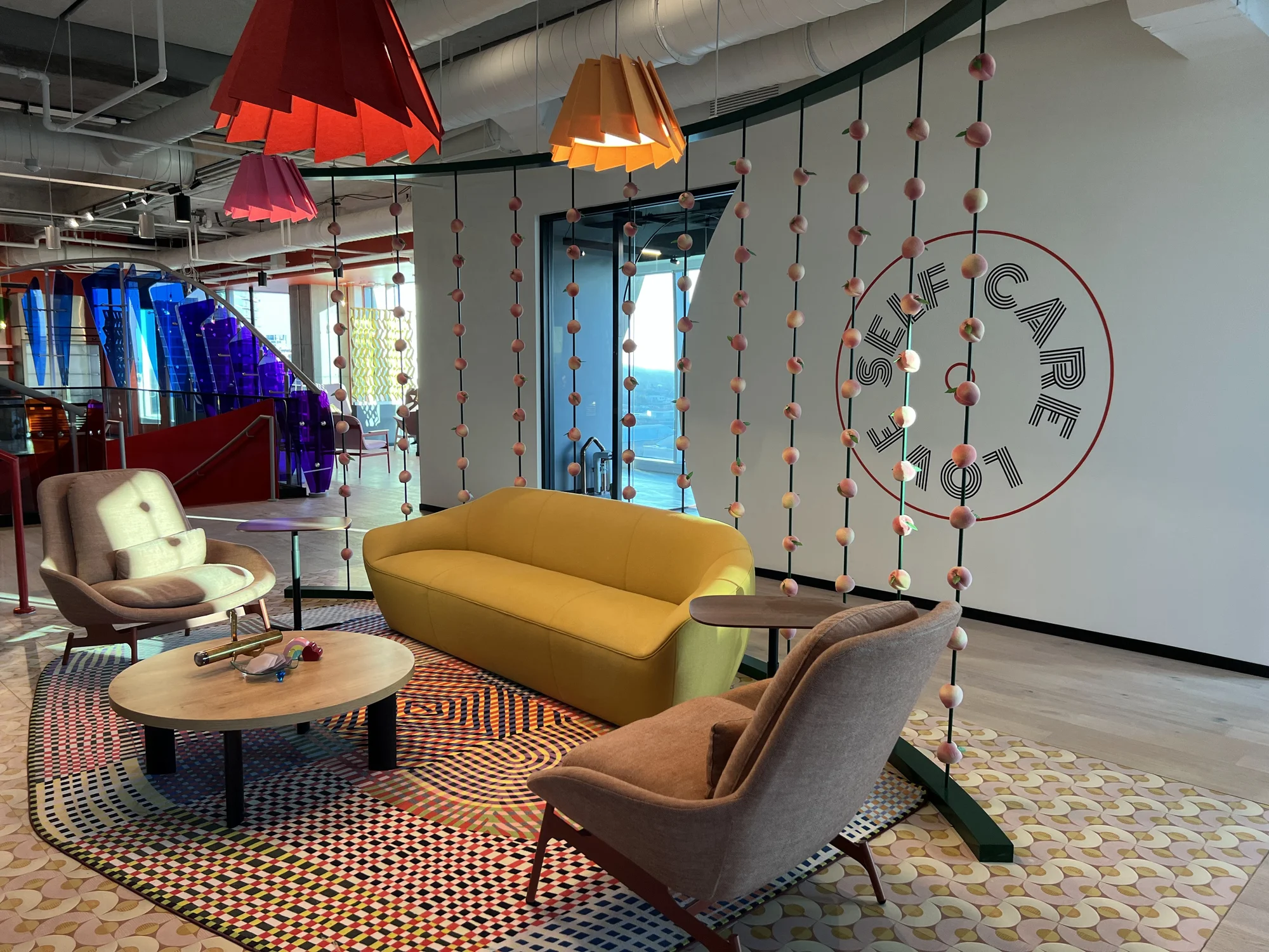 A Googler community area, decorated with Georgia peaches, a couch and additional seating