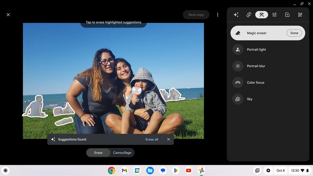 Laptop screen showing the magic eraser feature in Google Photos with suggestions for erasing highlighed