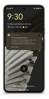 A Pixel 8 showing the new charger alert notification on the screen.