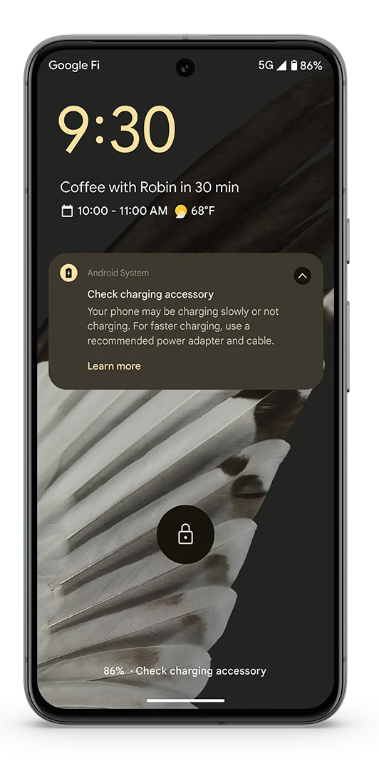 A Pixel 8 showing the new charger alert notification on the screen.