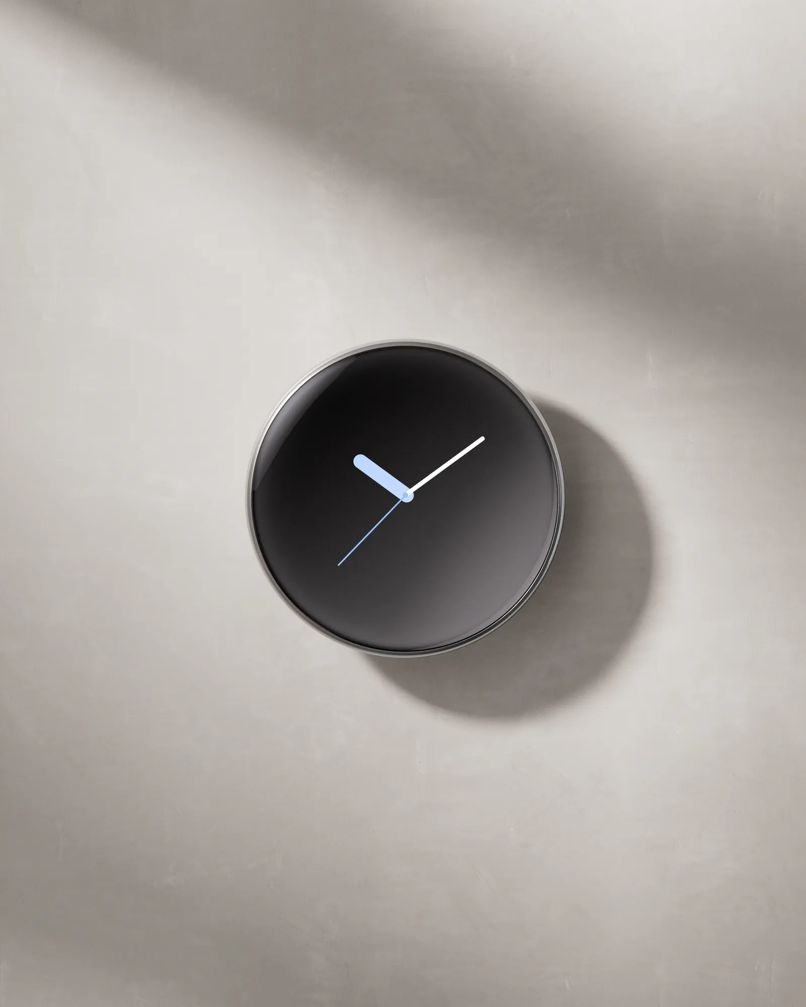 Polished Silver thermostat displayed on a wall in