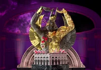 An image of a winged –  half-silver, half-gold – figure lifts their hands up in the air. The figure’s torso sits on top of a municipal building and marble block.