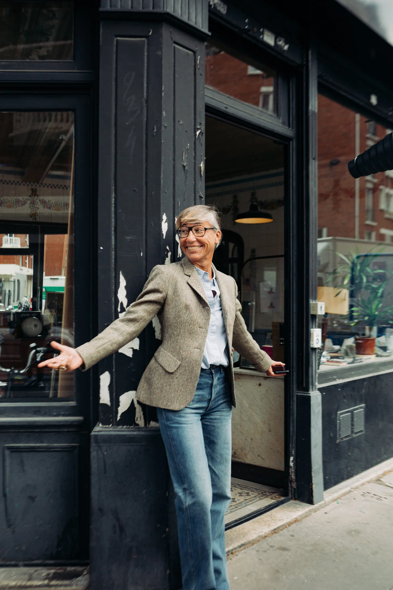 Photograph of a Laurence M. music producer in front of the record label with open arms