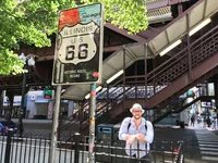 Photo of Matthew at the start of Route 66 in Chicago.