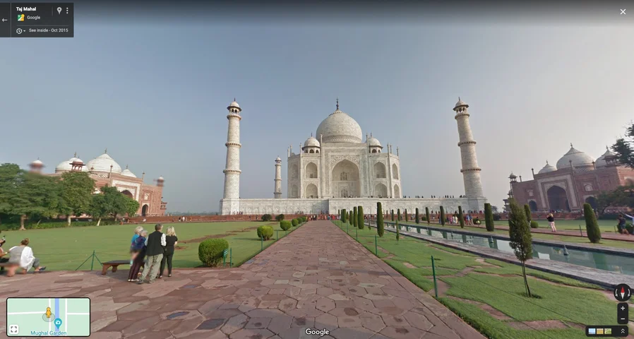 A Street View image of the Taj Mahal with people standing in front of it.