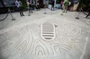 Commemorative sand mandala by Andres Amador at X's celebration of the moon landing