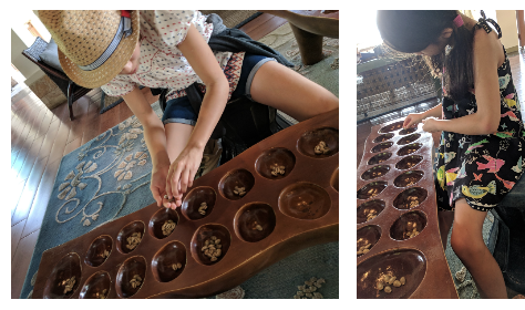 Two photos side by side, each with a girl with their head down in a living room, actively playing Sungka. The game is made of a long wooden piece with 16 holes and many shells.