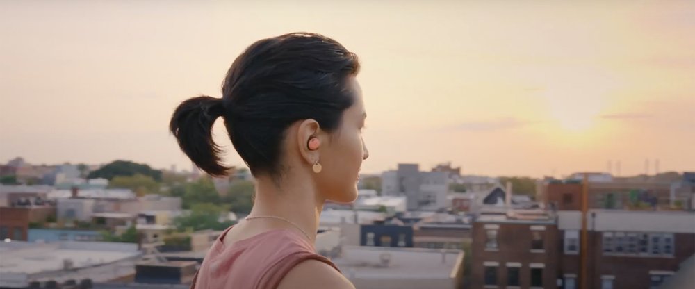 Image of a woman looking into the distance while wearing Pixel Buds Pro.