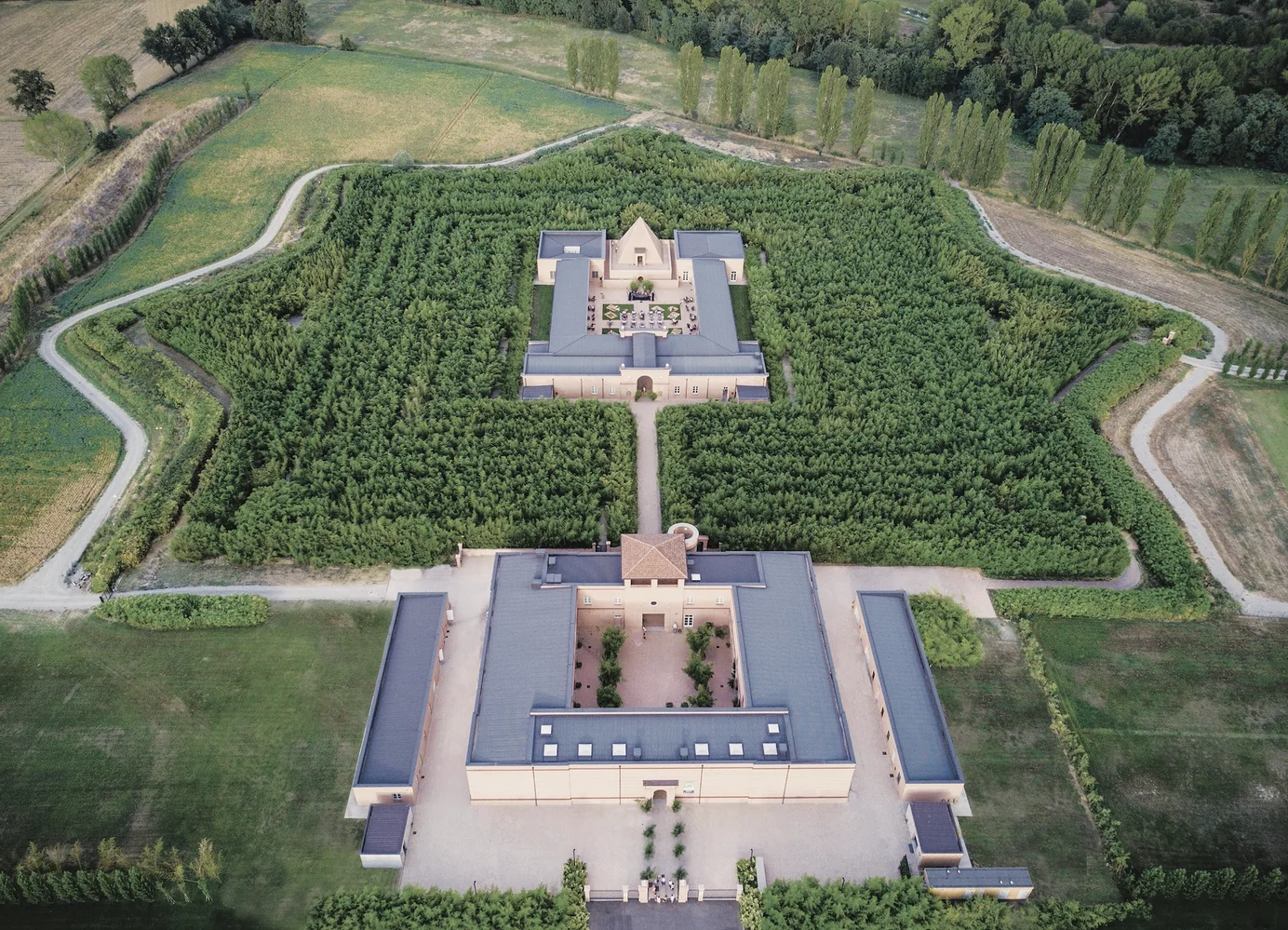 Almost shaped like a star, this maze is entirely made of bamboo trees and from this aerial view, you can spot the Masone Pyramid at the very center.