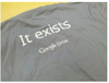 Photo of a gray shirt with the words "It exists, Google Drive" on it.