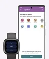 The Fitbit app shows possible moods to log, alongside a Sense 2 device with those mood options.