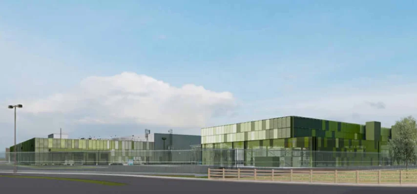 A rendering of what the data center will look like - a green glass building next to trees and against a blue sky