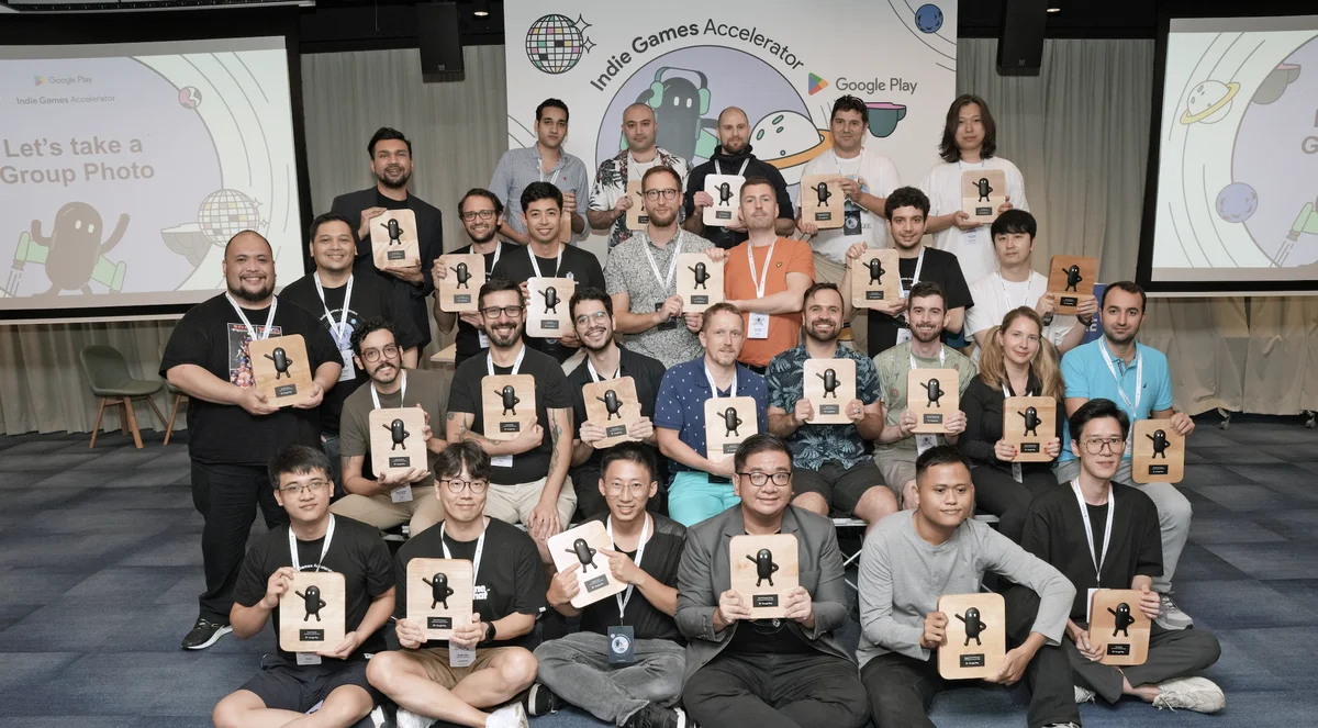 A group of people standing together with graduation plaques.