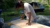 Ariel sanding a piece of wood on a table