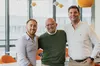 ALT TEXT: From L-R the male founders of Bfore.AI Luciano Allegro, Luigi Lenguito and Sebastian Cesario standing in front of of a table with windows and chairs in the background